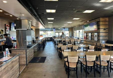 Absentee run branded Wings shop for sale in Tracy shopping center